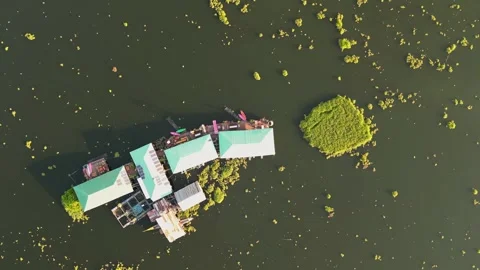 Drone flying over the lake with floating houses Video stock 259864127