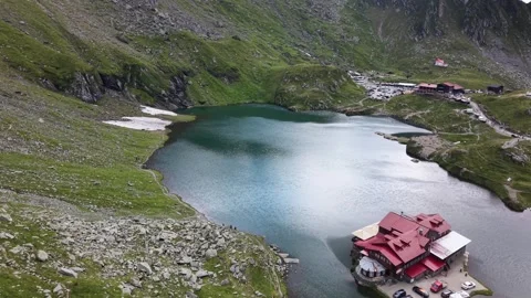 Drone flying over Lake restaurant toward parking area in the mountains Stock Footage 340824990