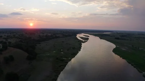 Drone Flying Over A Large River During Sunrise Vídeo Stock 347655515