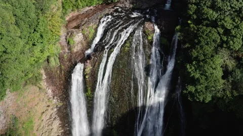 Drone flying over a large waterfall Japan Video stock 165571130