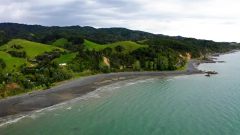 Drone Flying Over Lush Hillside From New Zealand's Coromandel Bay 4K 30FPS Stock Footage 234474595