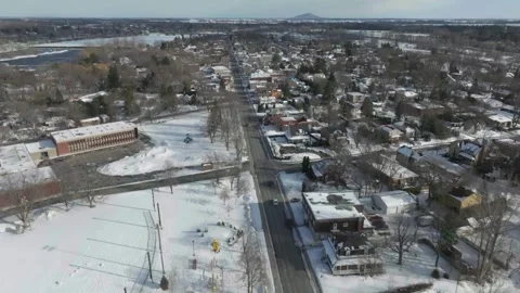 Drone flying over the main old street in chambly quebec canada in winter from Stock Footage 341584233