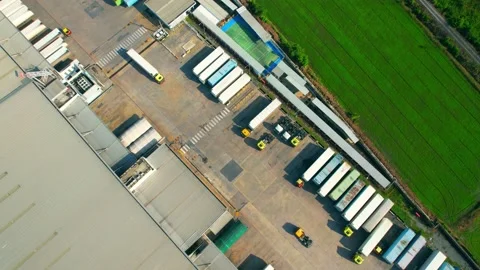 Drone flying over a many cargo containers and Semi-trailer trucks Stock Footage 225392593