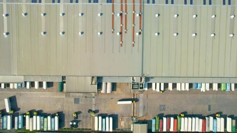 Drone flying over a many cargo containers and Semi-trailer trucks Stock Footage 225392829