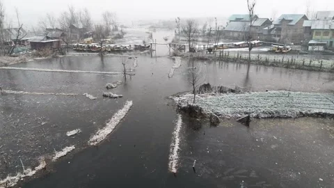 Drone flying over mist-filled canals where winter mornings unfold at a glacial Stock Footage 311020681