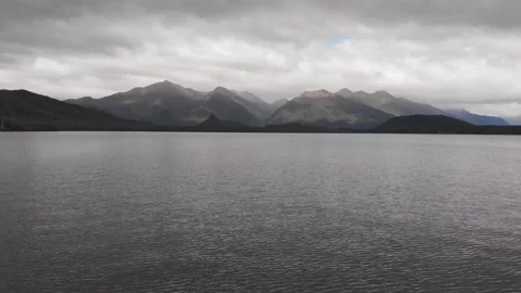 Drone Flying Over Mountain Lake In New Zealand, Drone Moving Backward Stock Footage 145808697