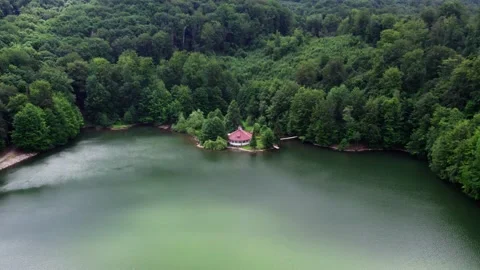 Drone Flying Over Mountain Lake And A Cabin Видео 201106484