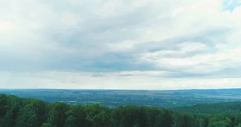 Drone flying over mountain ridge to open dramatic panorama on endless fields Stock Footage 126978267