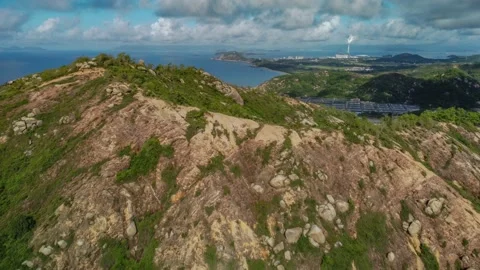 Drone flying over mountain ridge on an island Stockbeeldmateriaal 218414955