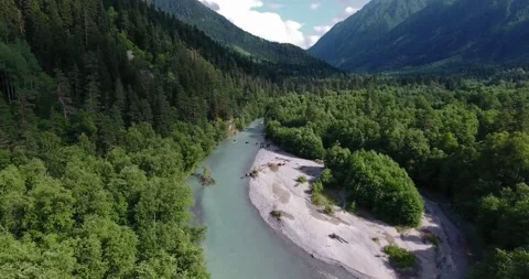 Drone flying over a mountain river in the green mountains Stock Footage 170567451