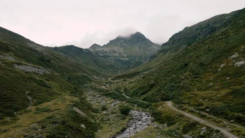 Drone flying over mountain river in front of Spadolazzo peak in Madesimo Vidéo 251559553