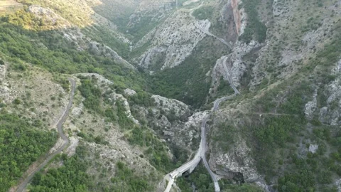Drone flying over a mountain road Stock Footage 248361419
