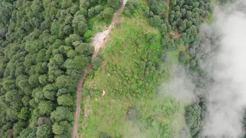 Drone Flying Over Mountain Road | Green Mountains and Clouds Passing Stock Footage 320880388