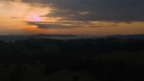 Drone flying over a mountain valley at sunset 4k HDR H264 Stock Footage 88323214