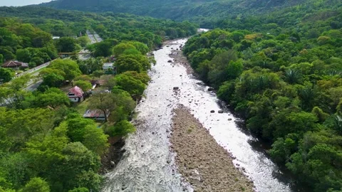 Drone flying over a natural river landscape, Green mountains and clean water Stock Footage 320146236