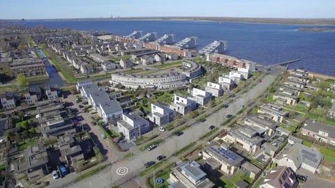 Drone flying over new build modern district in Huizen Noord-h Stock Footage 75351786