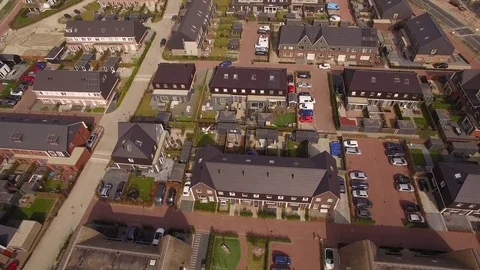 Drone flying over a new built houses in a neighborhood Stock Footage 75351578