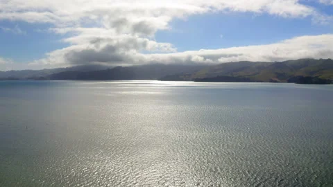 Drone Flying Over The Ocean Approaching Rolling Green Hills In New Zealand's Stock Footage 234648293