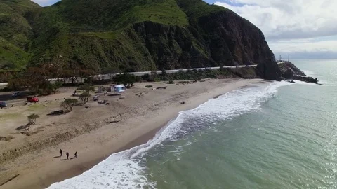 Drone Flying Over Ocean Backwards &amp; Ascending From Beach Stock Footage 78875543