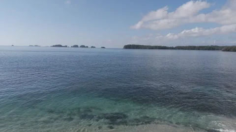 Drone Flying Over Ocean Toward Distant Islands on Horizon Stock Footage 320537940