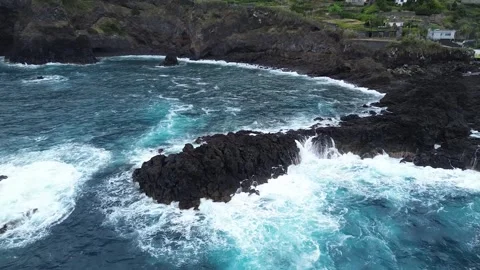 Drone Flying Over Ocean Waves Crashing on Rocks Outcrop – Madeira, Portugal Stock Footage 311435091