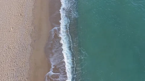 Drone Flying Over Ocean Waves Crashing on Sandy Beach Shoreline Stock Footage 320930803