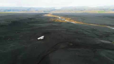 Drone flying over old crashed plane abandoned on Solheimasandur beach Stock Footage 233036008