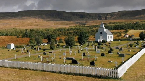 A drone is flying over an old Icelandic typical church Stock Footage 116126132