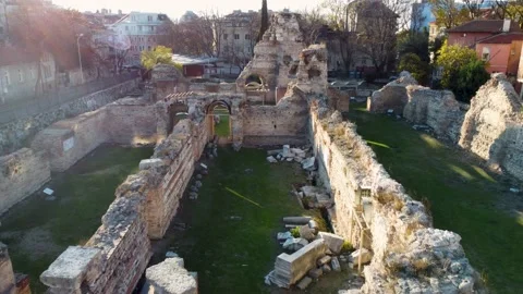 Drone flying over old ruins of Roman Thermae in Europe with green grass Stock Footage 226292925