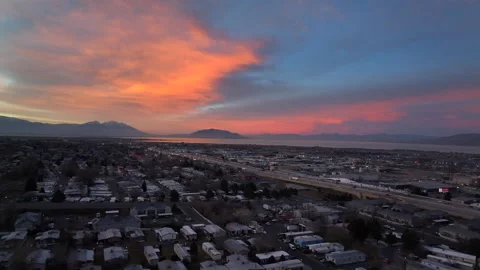 Drone flying over Orem Utah with incredible view of Utah Lake at sunrise Stock Footage 166537620