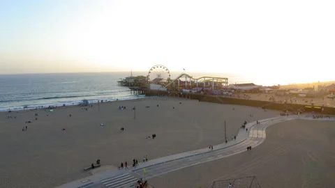 Drone Flying Over Palm Trees To Show Santa Monica Pier At Sunset 4K 24FPS Stock Footage 196123575