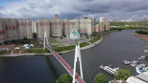 Drone flying over Pavshinsky bridge toward cathedral Stock Footage 326701696