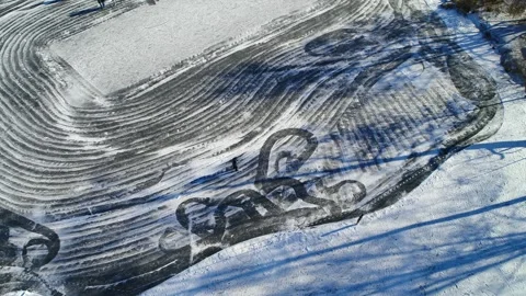 Drone flying over people skating on a frozen lake Video stock 283072491