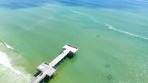 Drone Flying over Pier and Beach on a Sunny Day Stock Footage 311216582