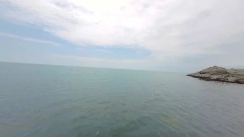 Drone flying over polluted ocean trash floating over water marine litter Peru Stock Footage 304644304