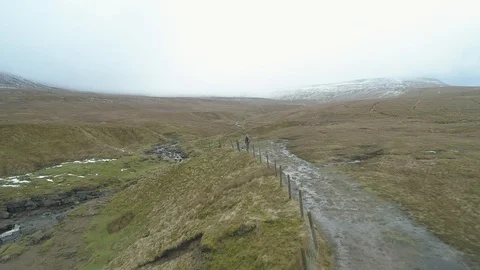 Drone Flying over a pot hole, Gaping Gill, Ingleborough, Yorkshire Stock Footage 88961409
