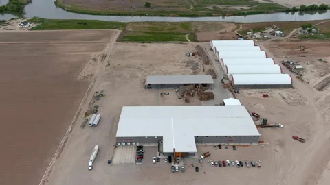 Drone flying over a produce processing plant in Parma Idaho April, 2024. Stock-Footage 276673361