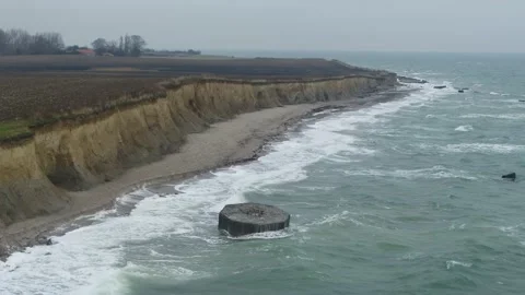 Drone flying over raw landscape, and a WWII bunker in Denmark, drone stock Stock Footage 138697246