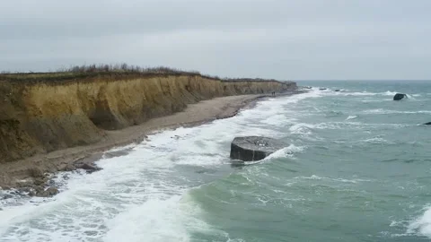 Drone flying over raw landscape, and a WWII bunker in Denmark, drone stock Stock Footage 138697699
