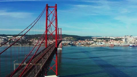 Drone flying over red 25 De April bridge. Lisbon, Portugal. Tagus river. Stock Footage 148728014