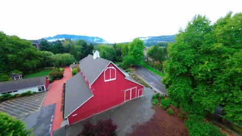 Drone Flying Over a Red Barn in Wooded Area (Color Graded) Stock Footage 252635401