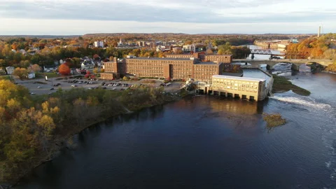 Drone Flying Over River And Factory Discharging Water In Rural Town In Autumn Stock Footage 229158722