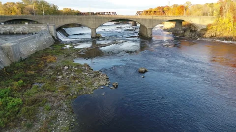 Drone Flying Over River And Bridges In Autumn Stock Footage 229159704