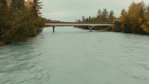 Drone Flying Over A River To A Bridge Video stock 229906629