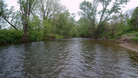 Drone Flying Over A River Close to Water 4k Video stock 126864407