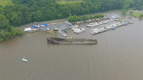 Drone Flying over River on a Cloudy Day with Shipwreck Stock Footage 311288100