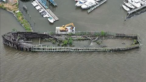 Drone Flying over River on a Cloudy Day with Shipwreck Stock Photos