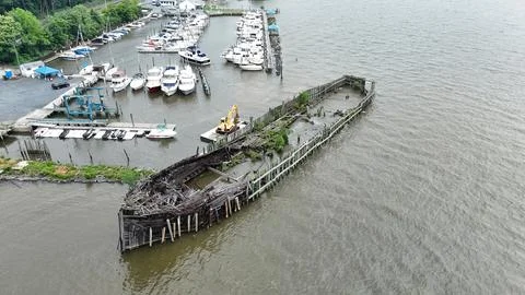 Drone Flying over River on a Cloudy Day with Shipwreck Stock Photos