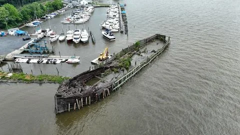 Drone Flying over River on a Cloudy Day with Shipwreck Stock Photos
