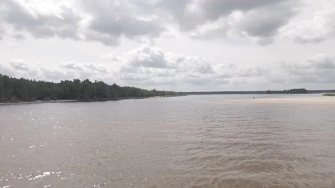Drone flying over a river delta near sea, birds flying around Stock Footage 161153625